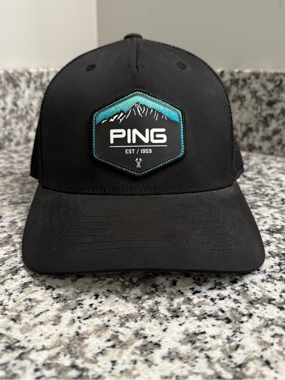 PING Black Hat with Teal Mountain Patch